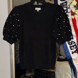Lucy Paris Black Ribbed Knit Top with pearl sleeve embellishment